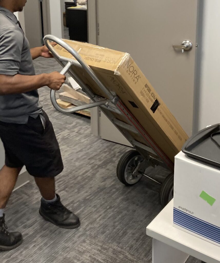 Mover with a large box on a dolly