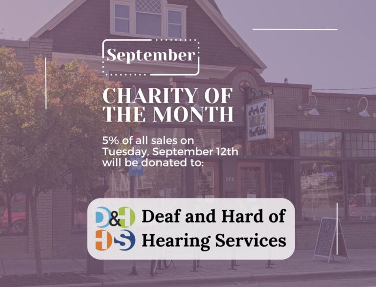 Image of art of the table store front. Over the image is text that reads: September Charity of the Month. 5% of all sales on Tuesday, September 12th will be donated to Deaf and Hard of Hearing Services