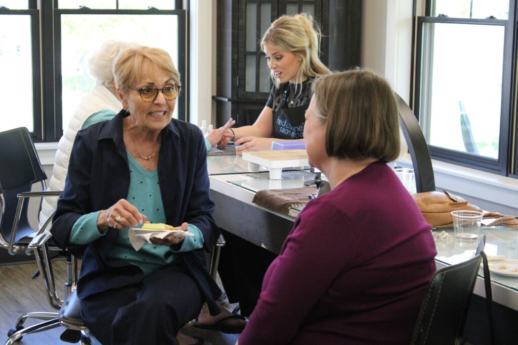 Two women sitting and talking with each other