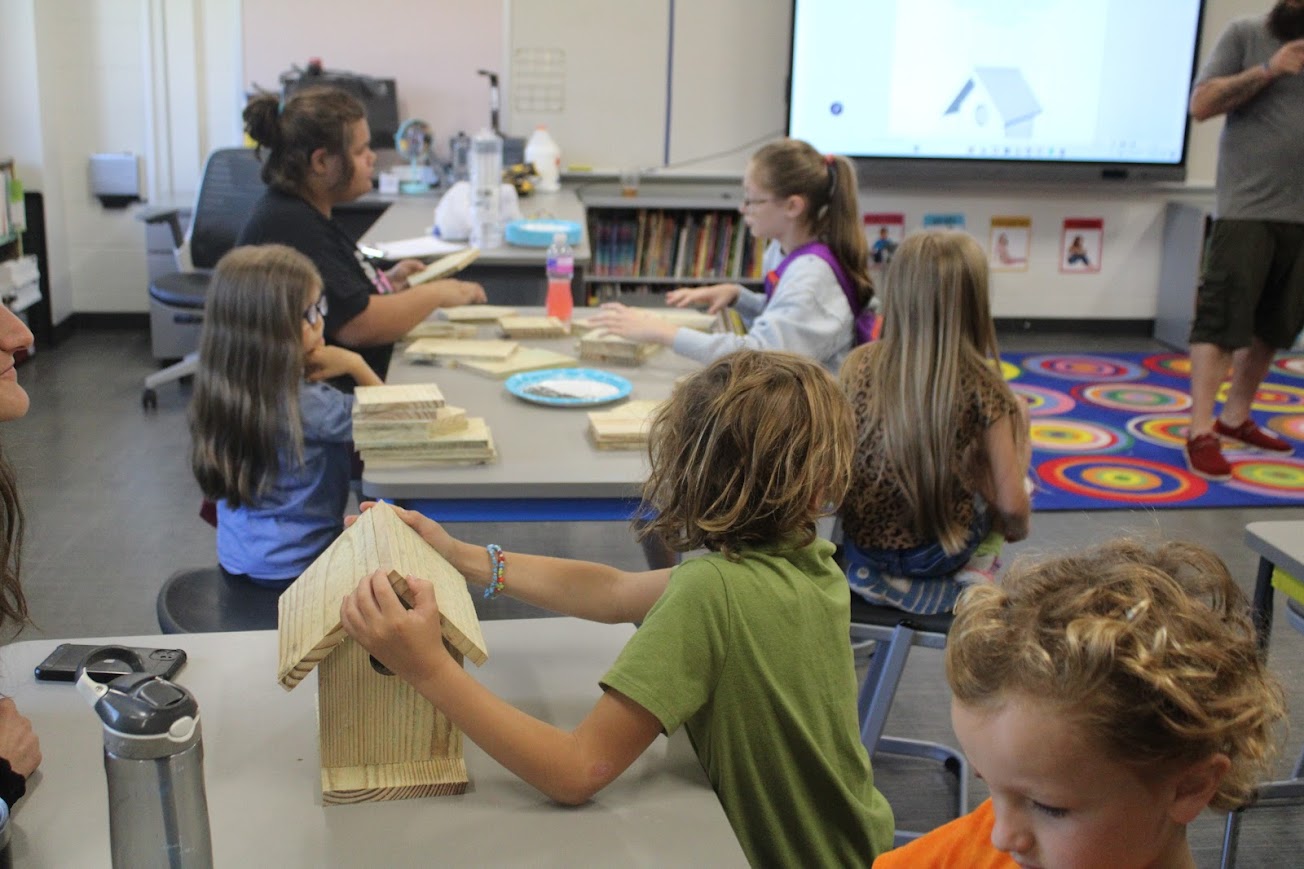 Kids building bird houses