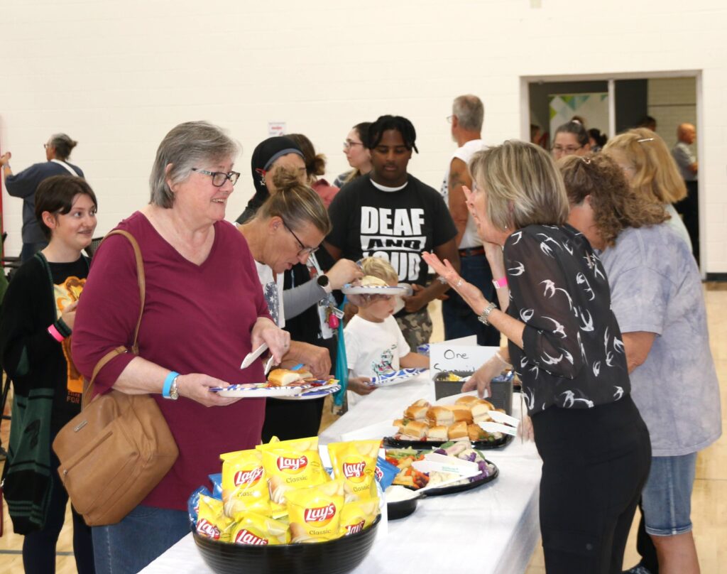 people in line to get food