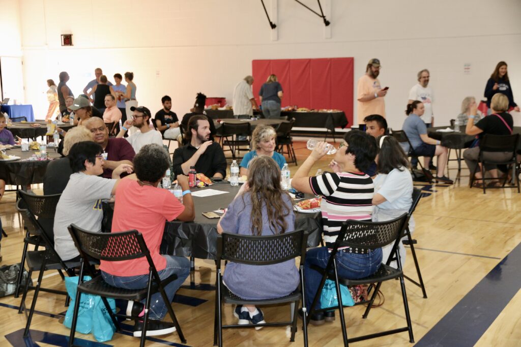 people seated around a large round table